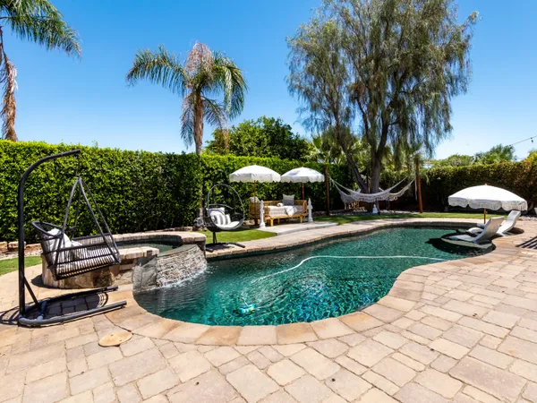 a view of a swimming pool with a garden
