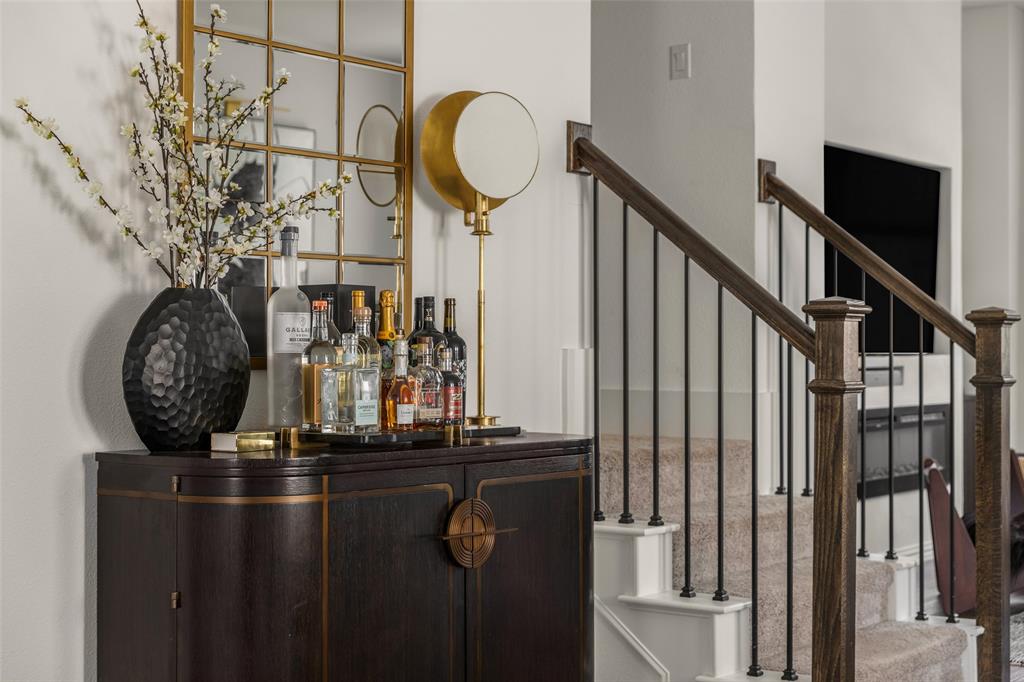 7537 Laburnam Road Dallas, TX 75228 - Photo 18 of 30 Dark wood-finish cabinetry featuring brass accents