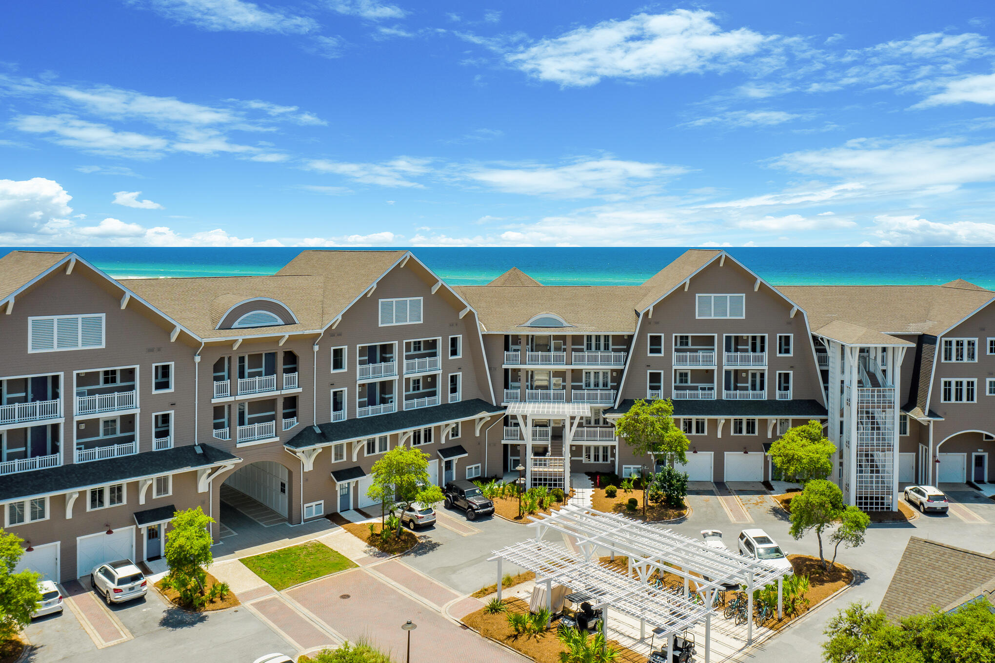 37 Compass Point Way South, Unit 107 Inlet Beach, FL 32461 - Photo 1 of 40 a view of a big house with wooden floor and outdoor seating