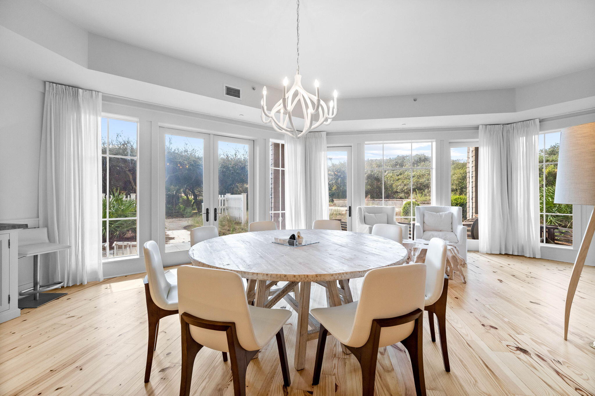 37 Compass Point Way South, Unit 107 Inlet Beach, FL 32461 - Photo 11 of 40 a view of a dining room with furniture wooden floor and chandelier