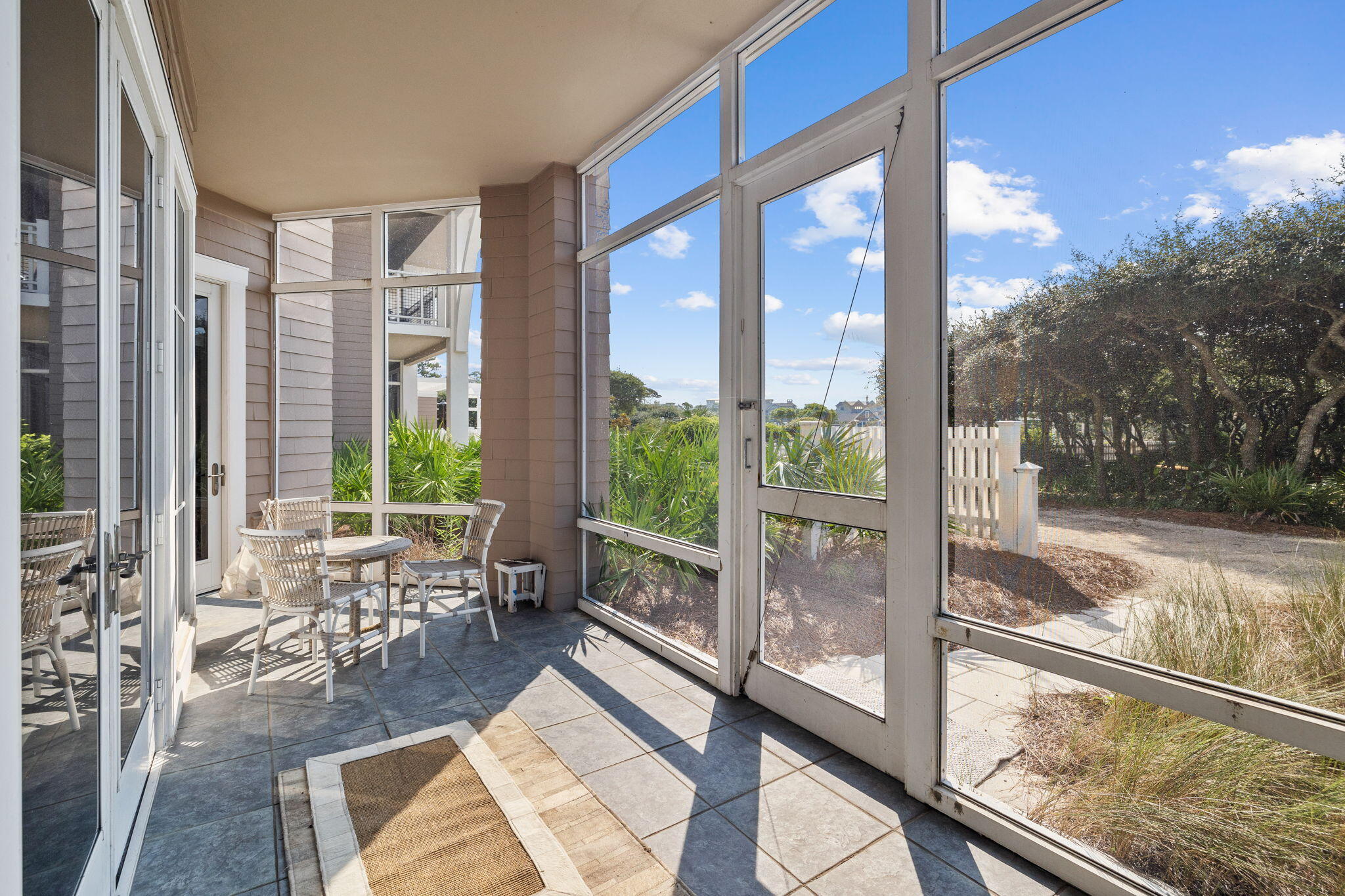 37 Compass Point Way South, Unit 107 Inlet Beach, FL 32461 - Photo 17 of 40 a living room with a large window and table