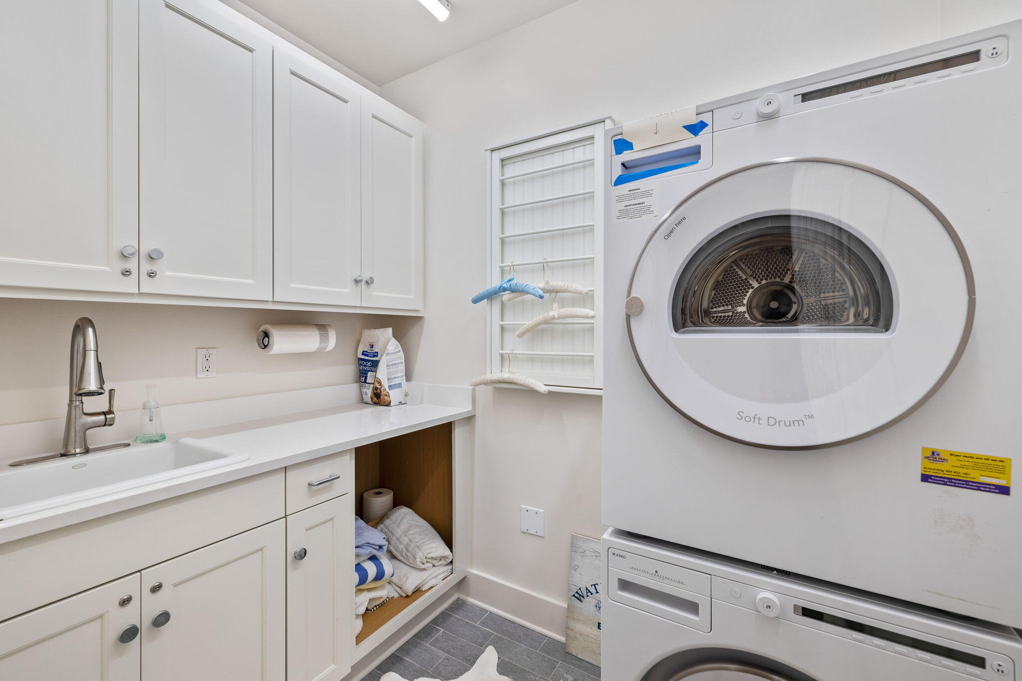 37 Compass Point Way South, Unit 107 Inlet Beach, FL 32461 - Photo 32 of 40 a utility room with sink dryer and washer
