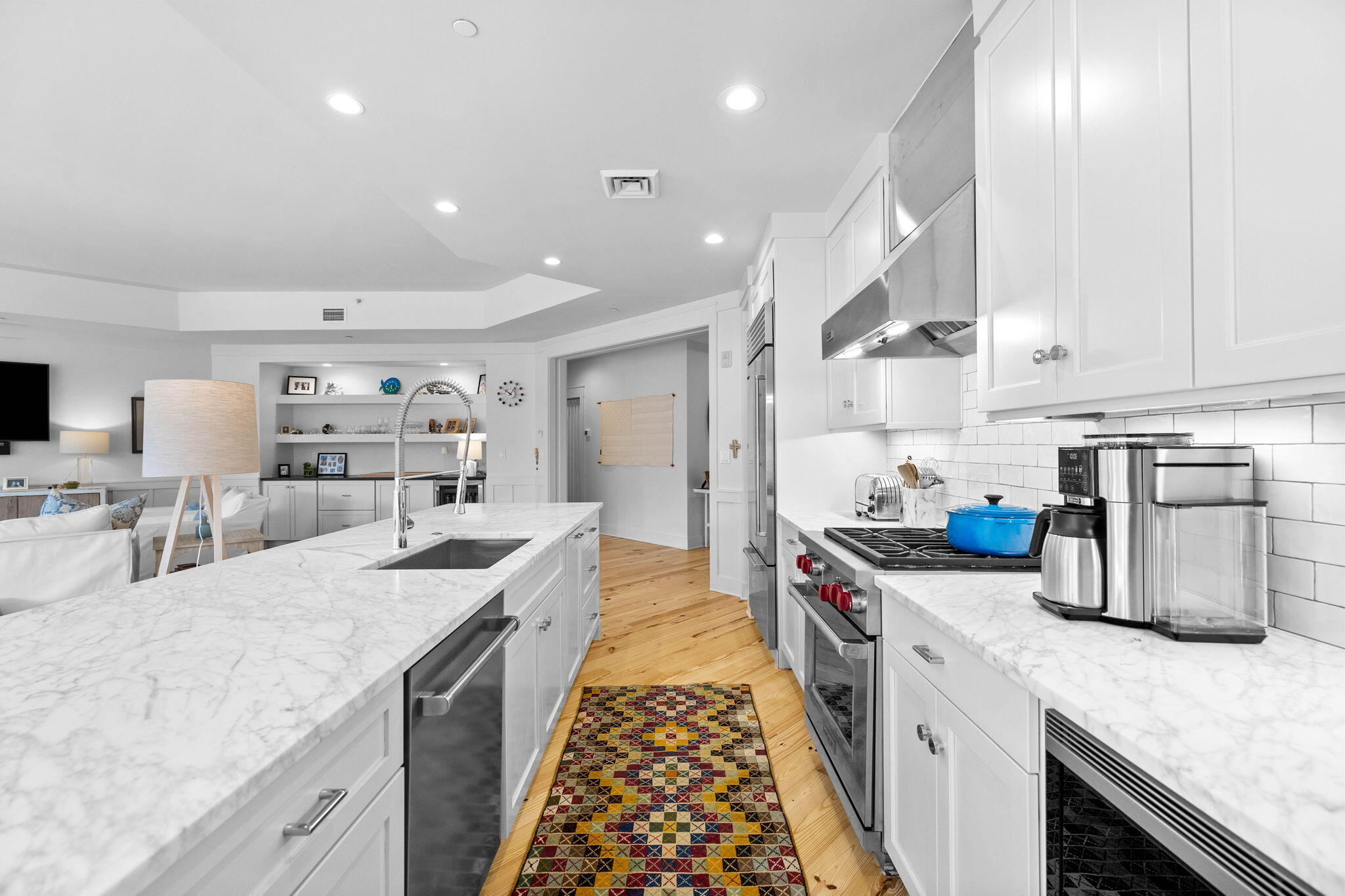 37 Compass Point Way South, Unit 107 Inlet Beach, FL 32461 - Photo 7 of 40 a large kitchen with stainless steel appliances granite countertop a lot of counter space and wooden floors