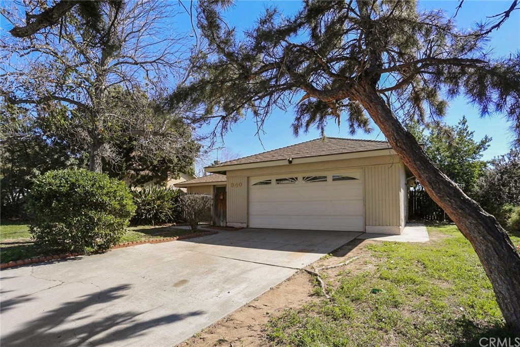 340 Maravilla Drive Riverside, CA 92507 - Photo 1 of 35 a front view of a house with a yard and garage