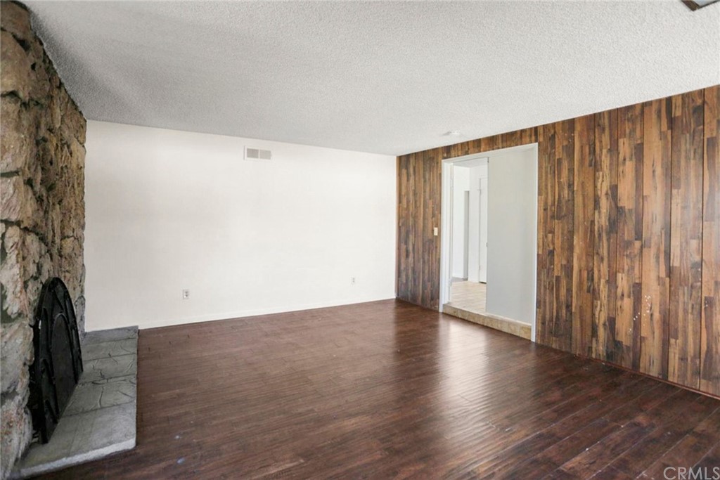 340 Maravilla Drive Riverside, CA 92507 - Photo 18 of 35 a view of an empty room with wooden floor and a window
