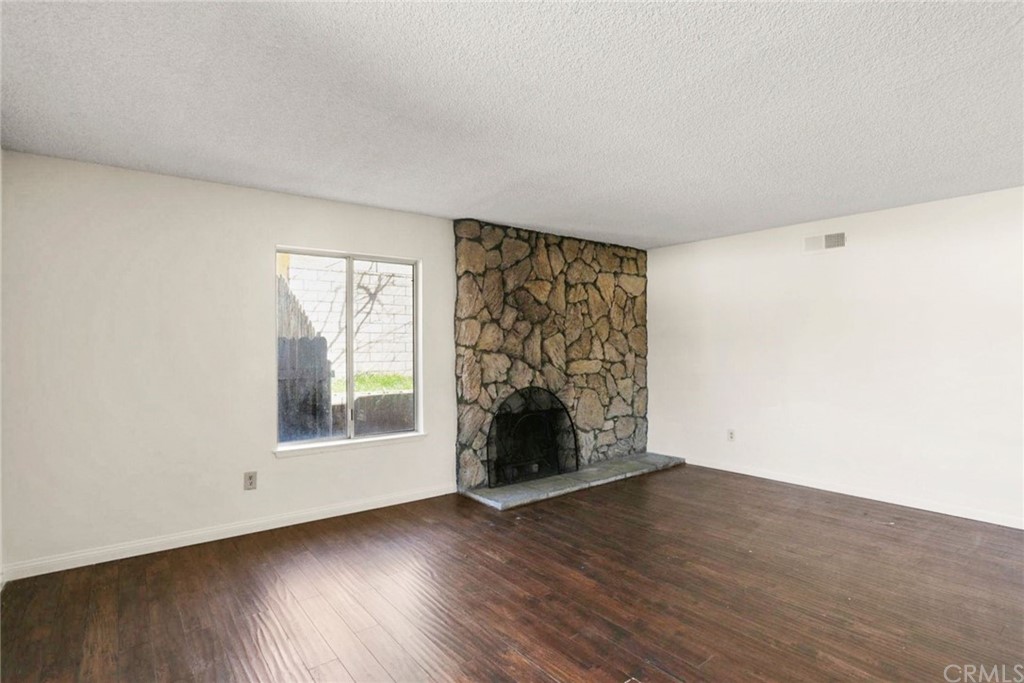 340 Maravilla Drive Riverside, CA 92507 - Photo 20 of 35 an empty room with wooden floor and windows