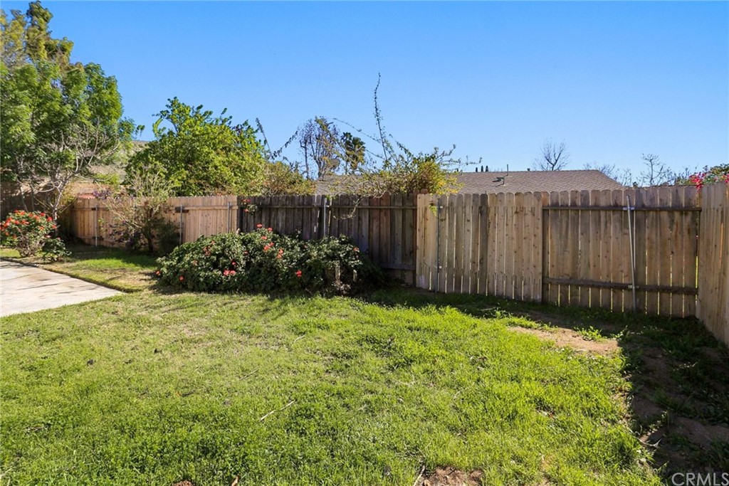 340 Maravilla Drive Riverside, CA 92507 - Photo 31 of 35 a view of a backyard with potted plants and a large tree