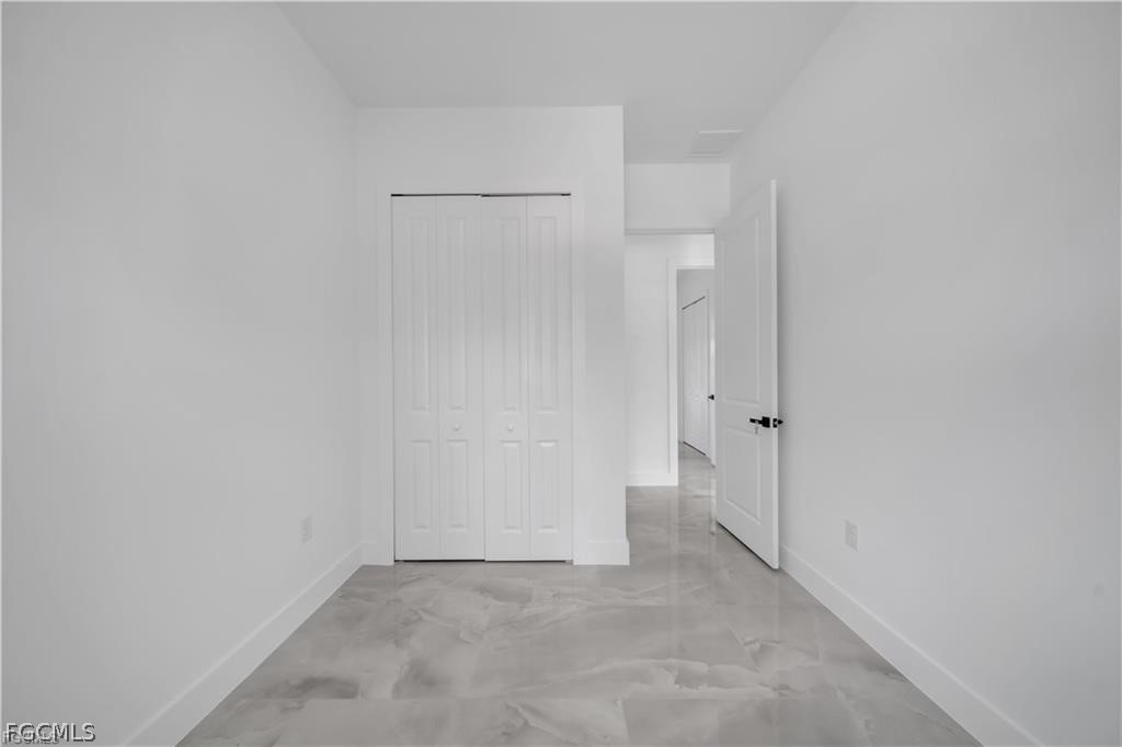 711 Roma Avenue South Lehigh Acres, FL 33974 - Photo 18 of 38 a view of an empty room