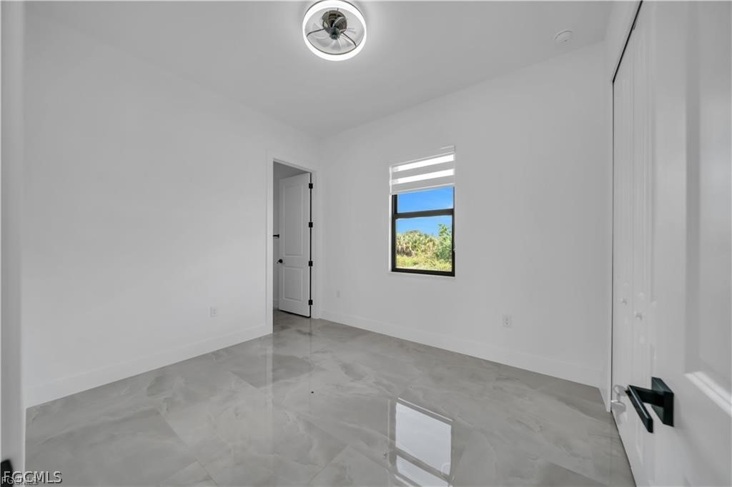711 Roma Avenue South Lehigh Acres, FL 33974 - Photo 19 of 38 a view of an empty room