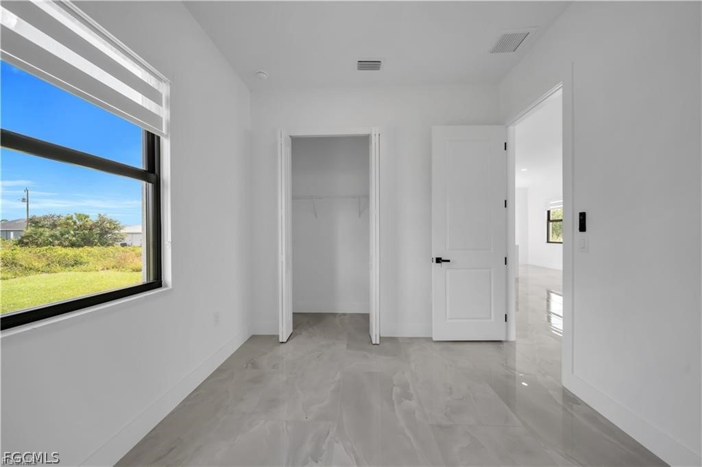 711 Roma Avenue South Lehigh Acres, FL 33974 - Photo 20 of 38 a view of a room with a large window