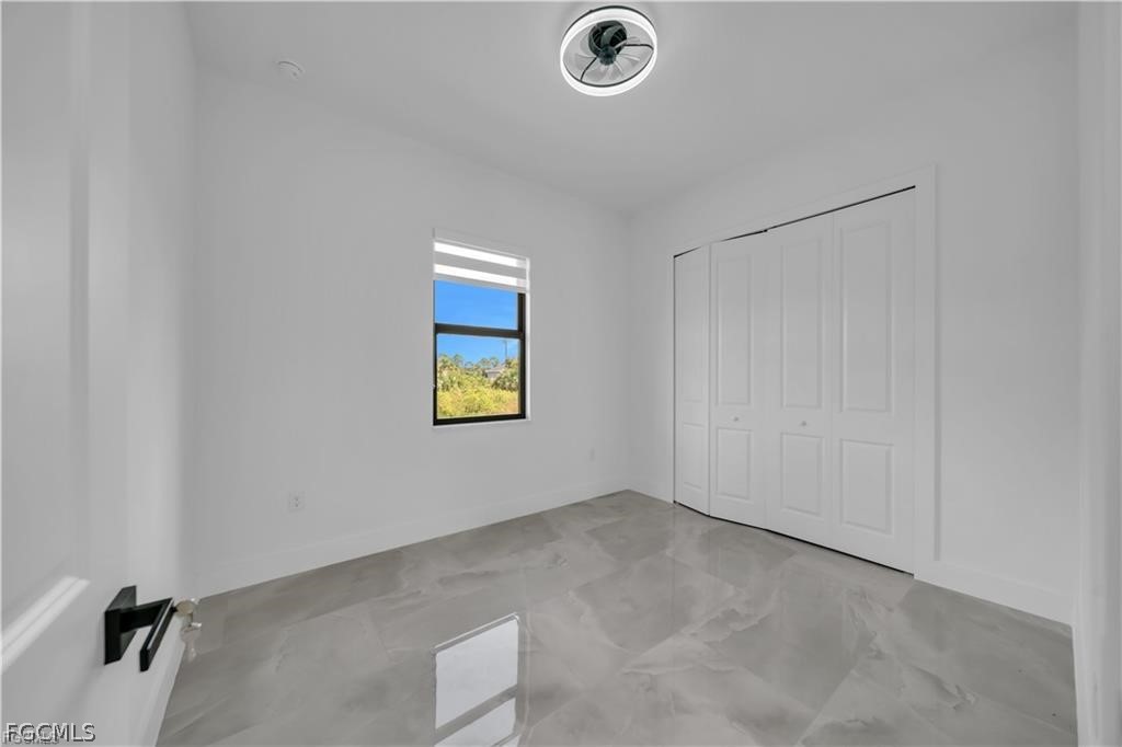 711 Roma Avenue South Lehigh Acres, FL 33974 - Photo 22 of 38 a view of a utility room with a window