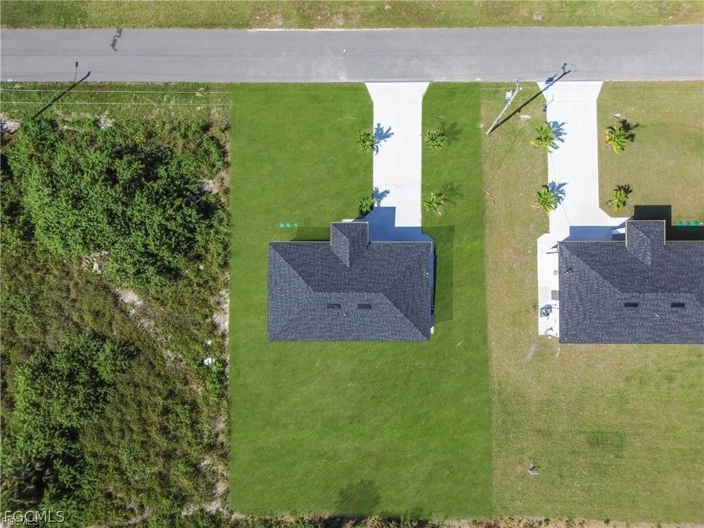 711 Roma Avenue South Lehigh Acres, FL 33974 - Photo 36 of 38 a view of a big yard with potted plants