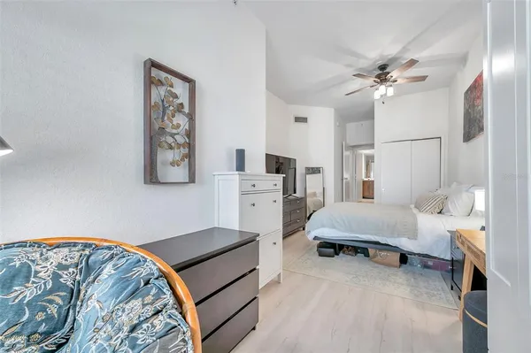 a bedroom with furniture and a chandelier