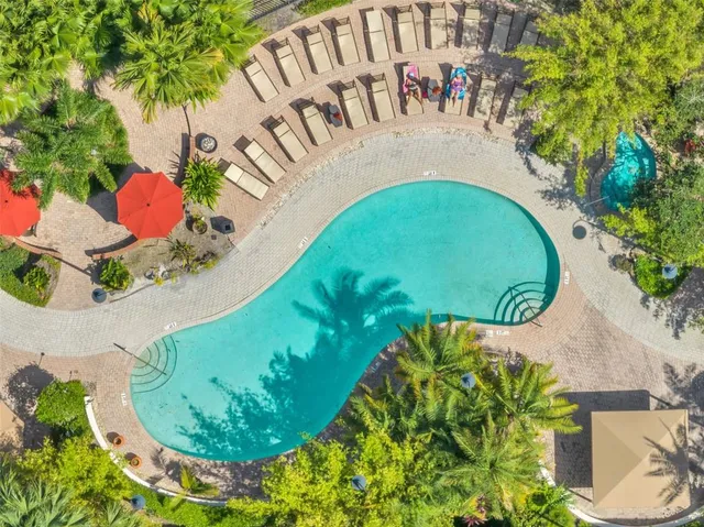 a view of a swimming pool in a backyard