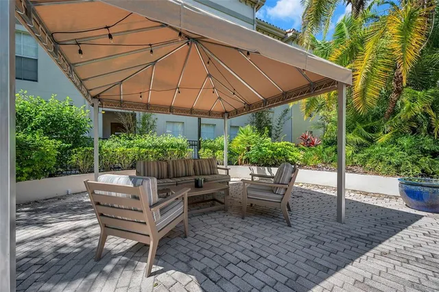 a view of a chair and table in the patio