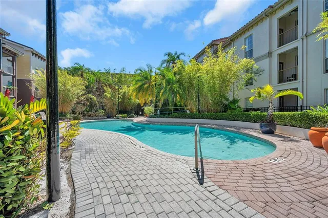 a view of a swimming pool with a patio