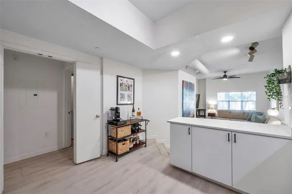 a kitchen with sink and cabinets
