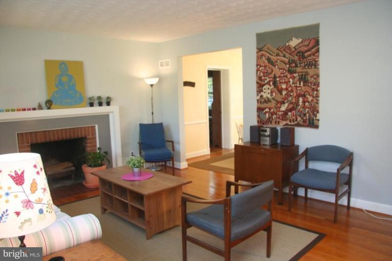 1706 Donald Place Silver Spring, MD 20902 - Photo 3 of 30 a living room with furniture and a fireplace