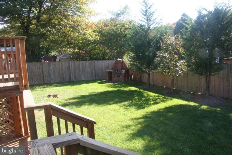 1706 Donald Place Silver Spring, MD 20902 - Photo 23 of 30 a view of a backyard with a small cabin and wooden fence
