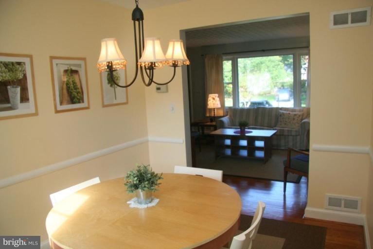 1706 Donald Place Silver Spring, MD 20902 - Photo 6 of 30 a view of a dining room with furniture and wooden floor