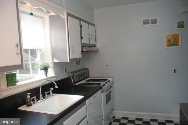 1706 Donald Place Silver Spring, MD 20902 - Photo 10 of 30 a bathroom with a sink and a mirror
