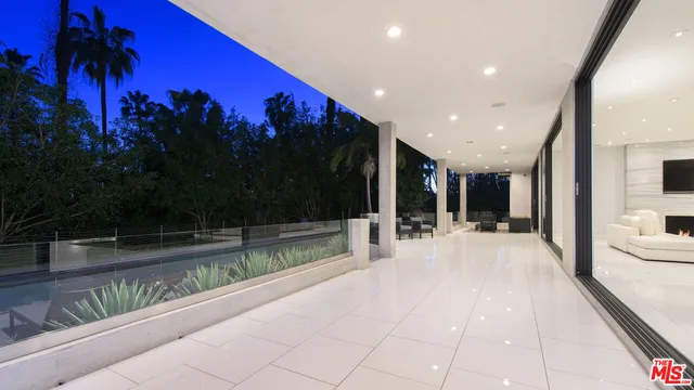 a lobby with a couch and a garden