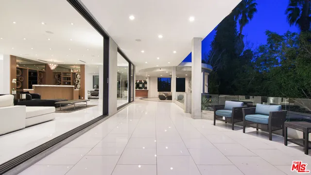 a lobby with furniture and a potted plant