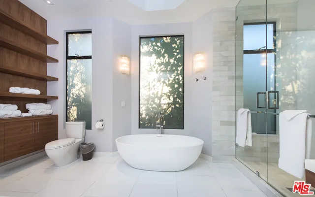 a bathroom with a bathtub and shower