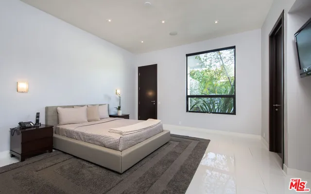 a bathroom with a double vanity sink and a large mirror