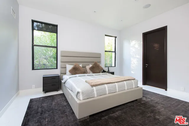 a bathroom with a granite countertop sink mirror and double