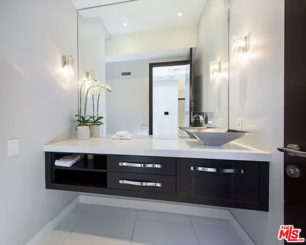a kitchen with a sink stove and refrigerator