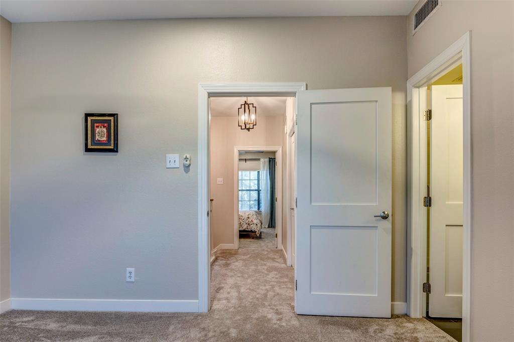 5859 Frankford Road, Unit 107 Dallas, TX 75252 - Photo 24 of 37 a view of a hallway with wooden floor and closet