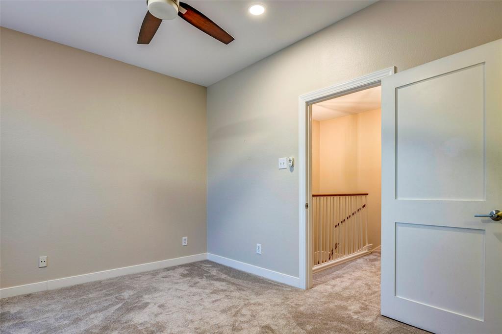 5859 Frankford Road, Unit 107 Dallas, TX 75252 - Photo 25 of 37 an empty room with closet and a chandelier fan