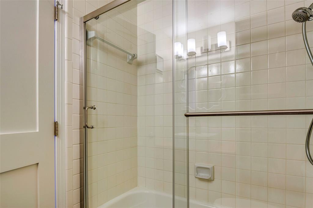 5859 Frankford Road, Unit 107 Dallas, TX 75252 - Photo 28 of 37 a bathroom with a glass door shower