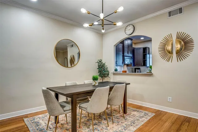 a dining room with furniture and a mirror
