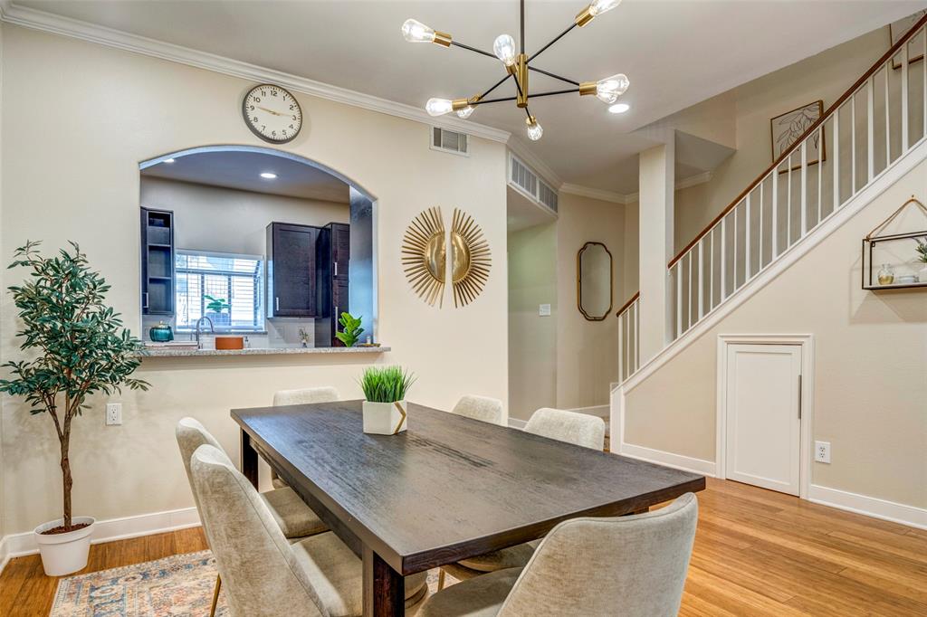 5859 Frankford Road, Unit 107 Dallas, TX 75252 - Photo 4 of 37 a view of a dining room with furniture and a chandelier