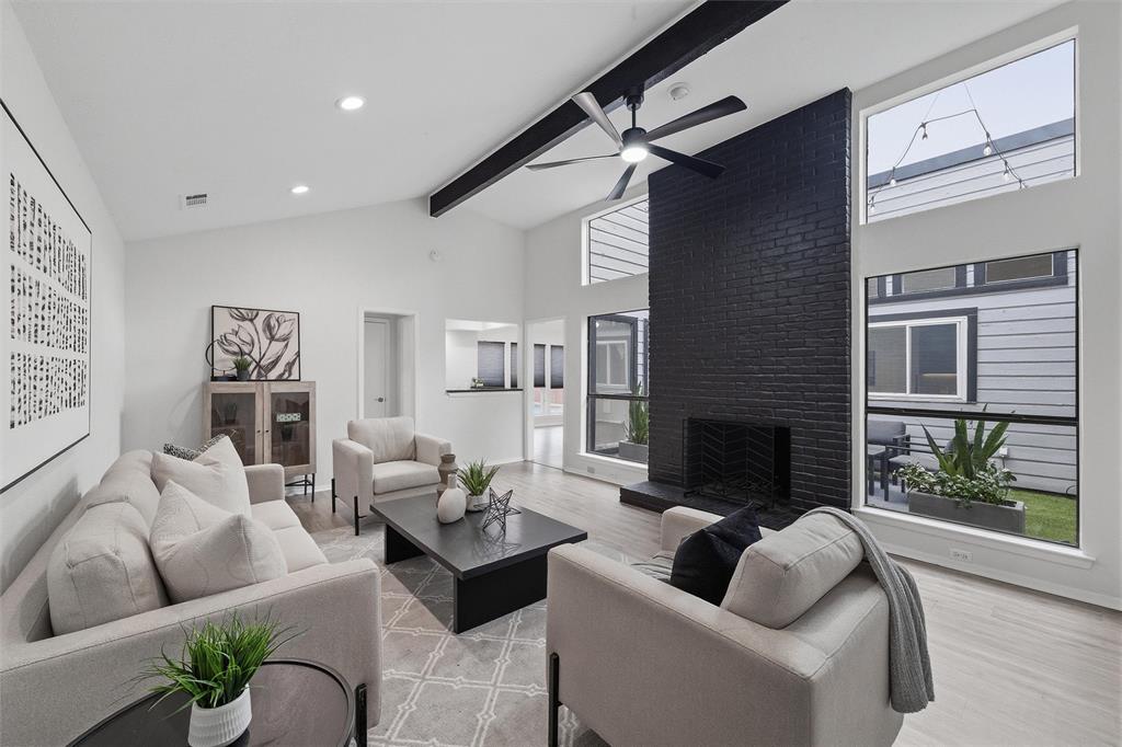 6029 Spring Flower Trail Dallas, TX 75248 - Photo 14 of 37 a living room with furniture and a fireplace