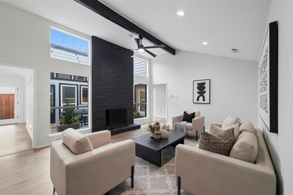 6029 Spring Flower Trail Dallas, TX 75248 - Photo 15 of 37 a living room with furniture and a fireplace