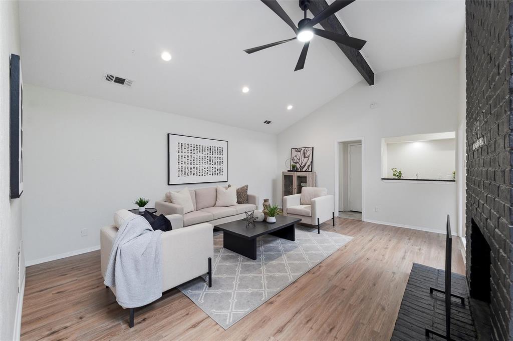 6029 Spring Flower Trail Dallas, TX 75248 - Photo 16 of 37 a living room with furniture and a wooden floor