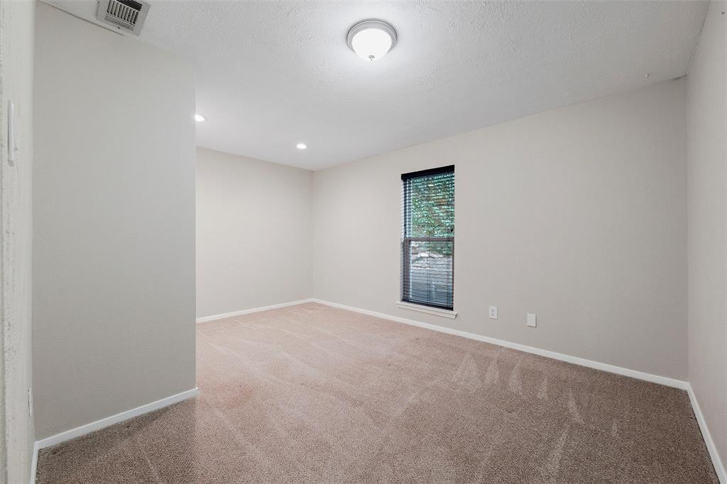 6029 Spring Flower Trail Dallas, TX 75248 - Photo 30 of 37 an empty room with windows