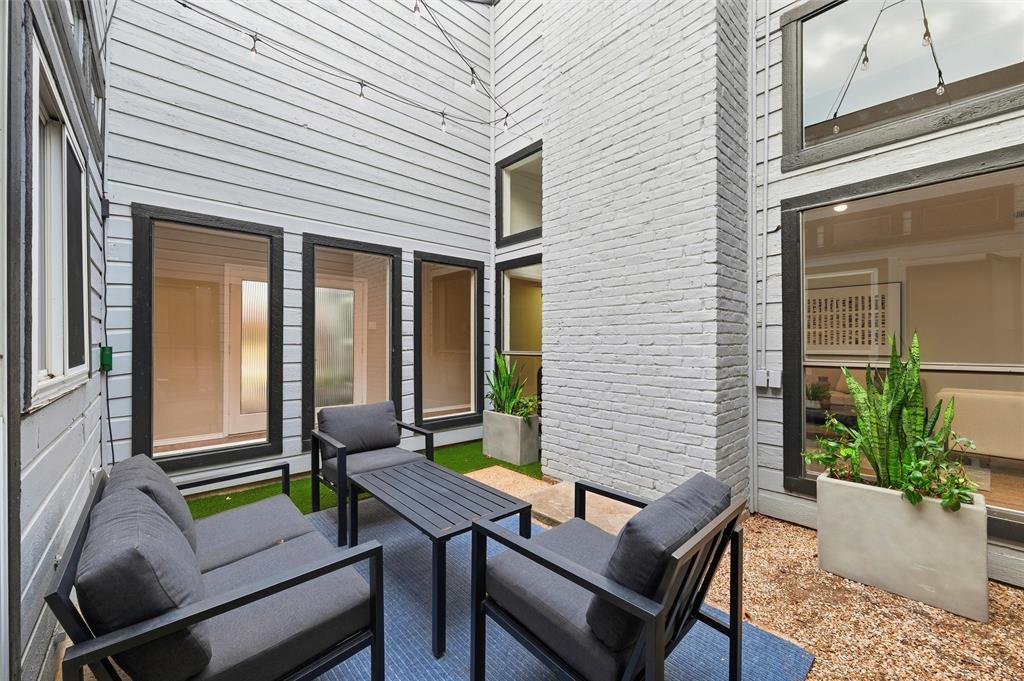 6029 Spring Flower Trail Dallas, TX 75248 - Photo 7 of 37 a view of a patio with couple of chairs and a potted plant