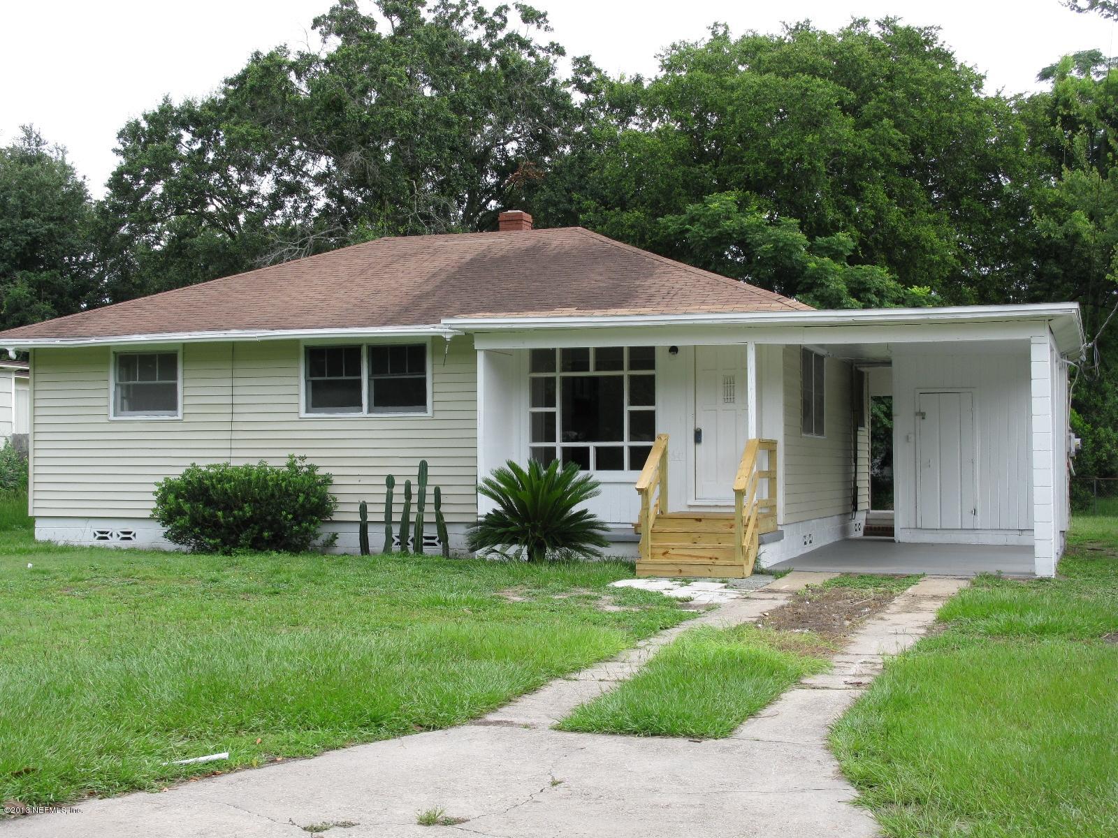6641 Ector Road Jacksonville, FL 32211 - Photo 1 of 15 a view of a house with a yard and plants