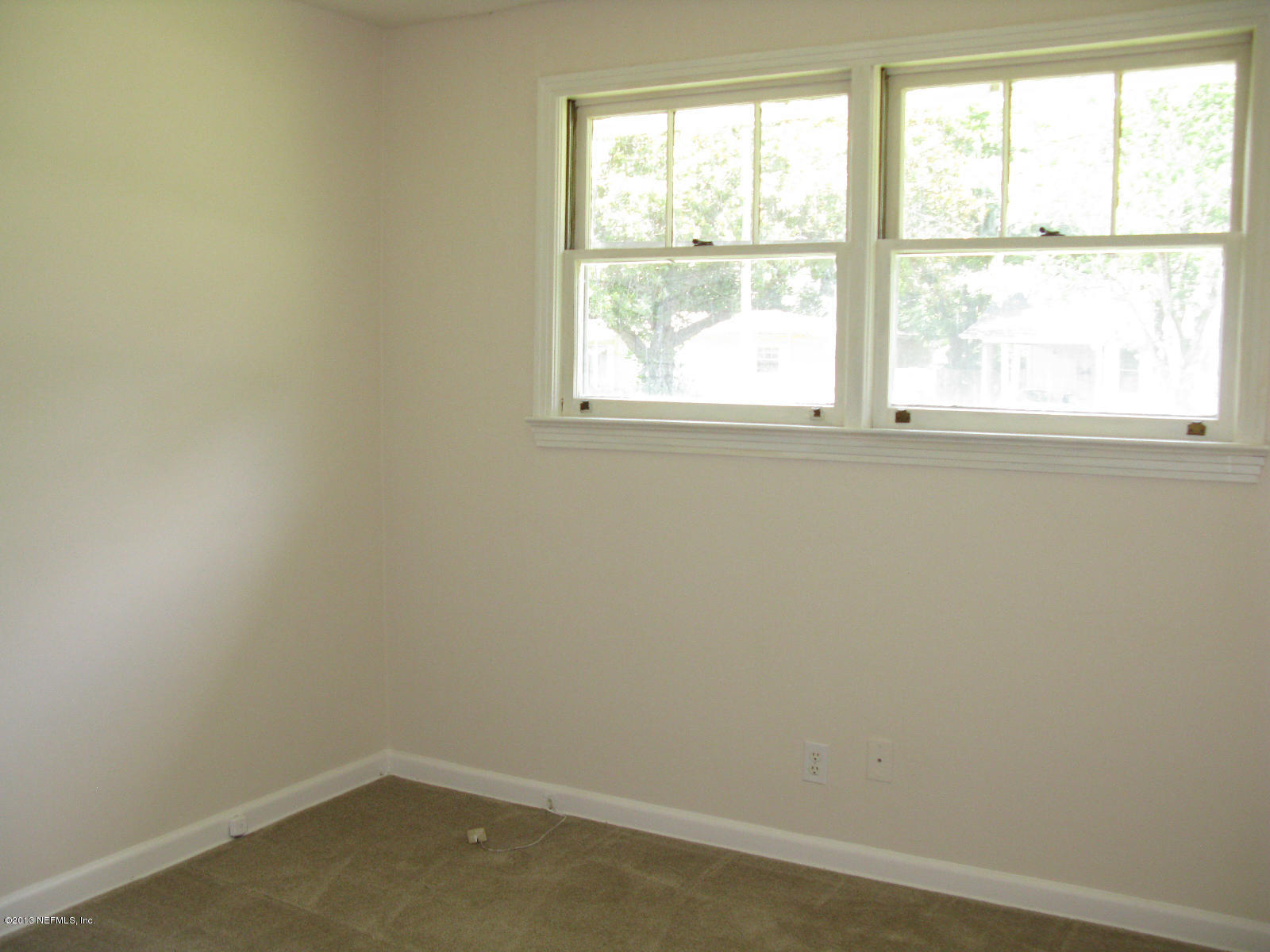 6641 Ector Road Jacksonville, FL 32211 - Photo 11 of 15 an empty room with a window