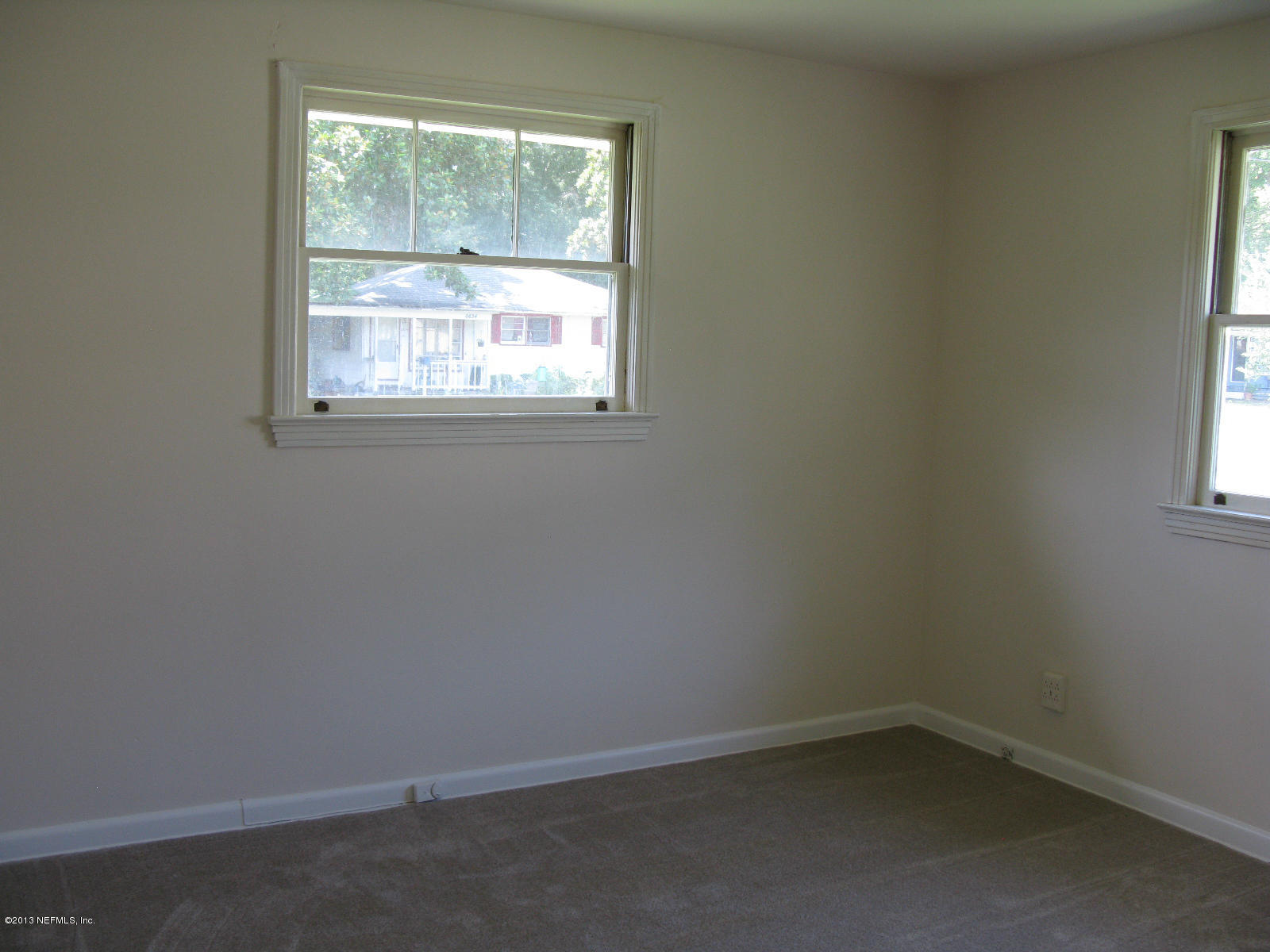 6641 Ector Road Jacksonville, FL 32211 - Photo 13 of 15 an empty room with a window