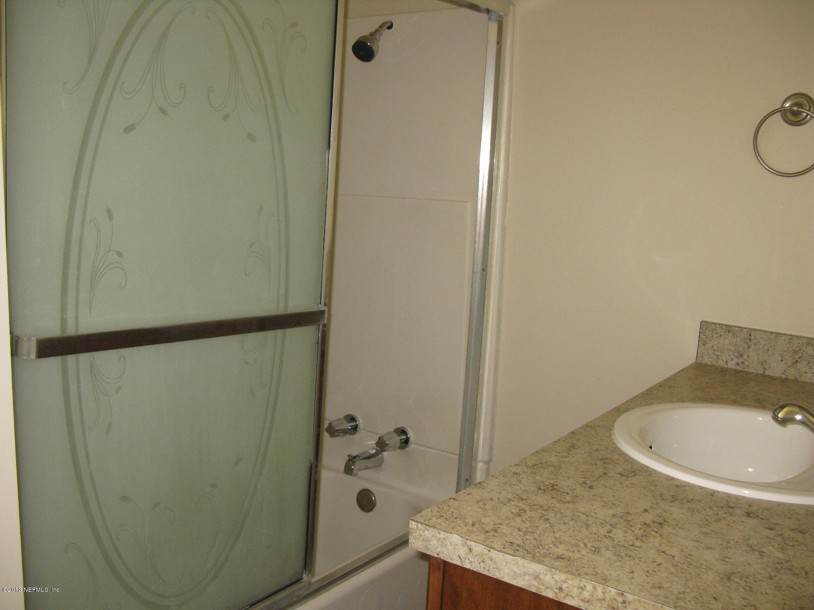 6641 Ector Road Jacksonville, FL 32211 - Photo 14 of 15 a bathroom with a sink and a mirror