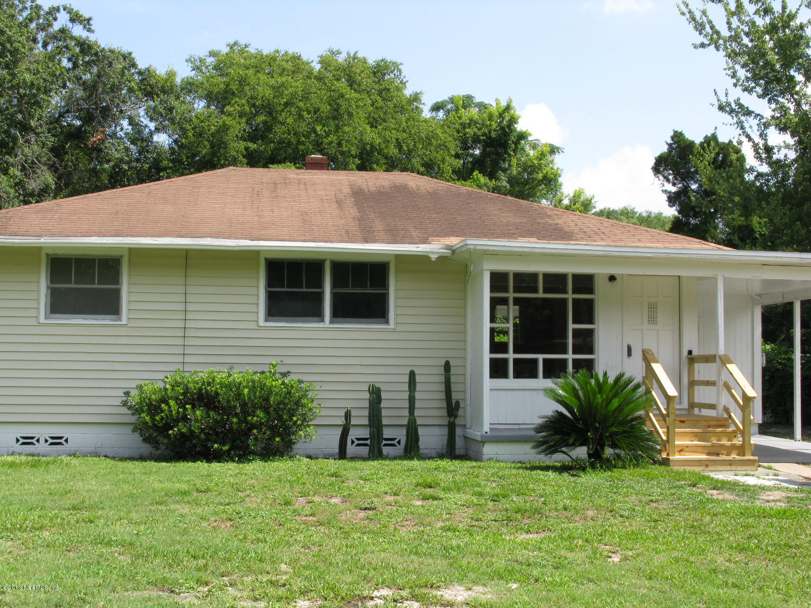 6641 Ector Road Jacksonville, FL 32211 - Photo 2 of 15 a view of a house with a yard
