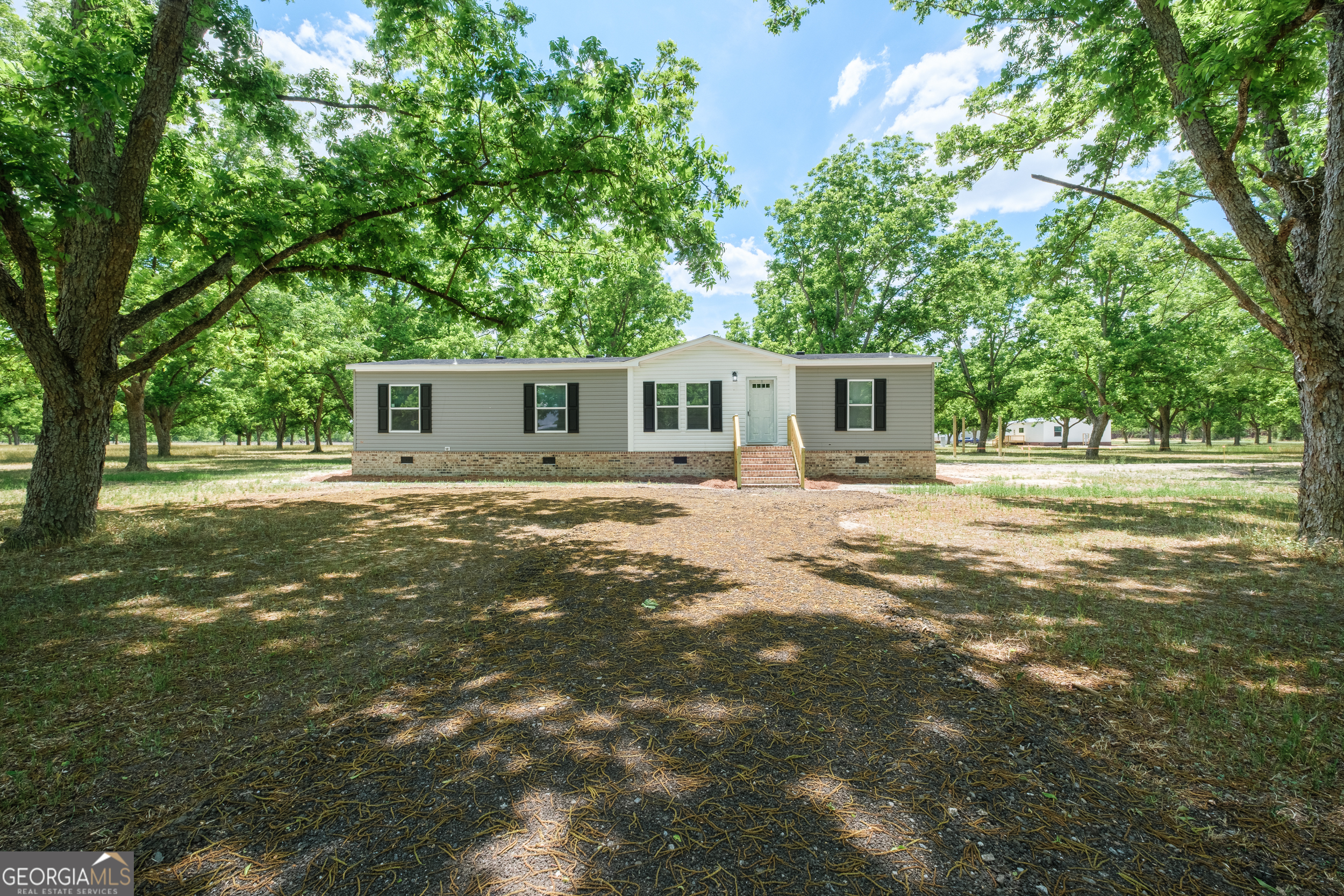 2959 Lake Lannell Road Odum, GA 31555 - Photo 1 of 30 a front view of a house with a yard