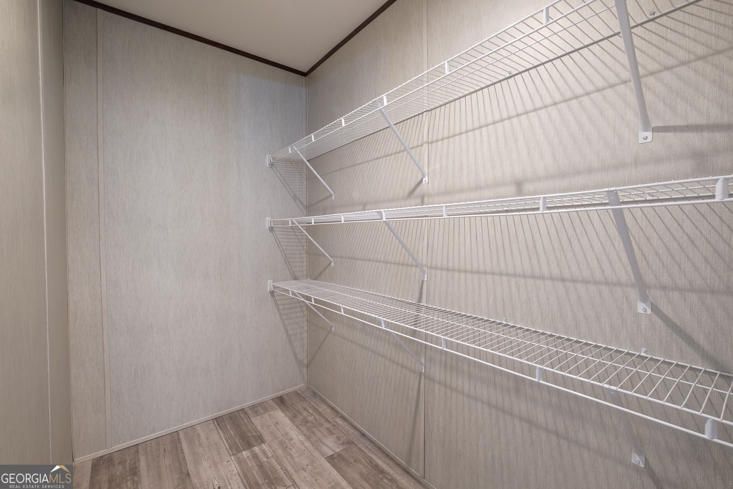 2959 Lake Lannell Road Odum, GA 31555 - Photo 13 of 30 a view of a room with racks on the wall