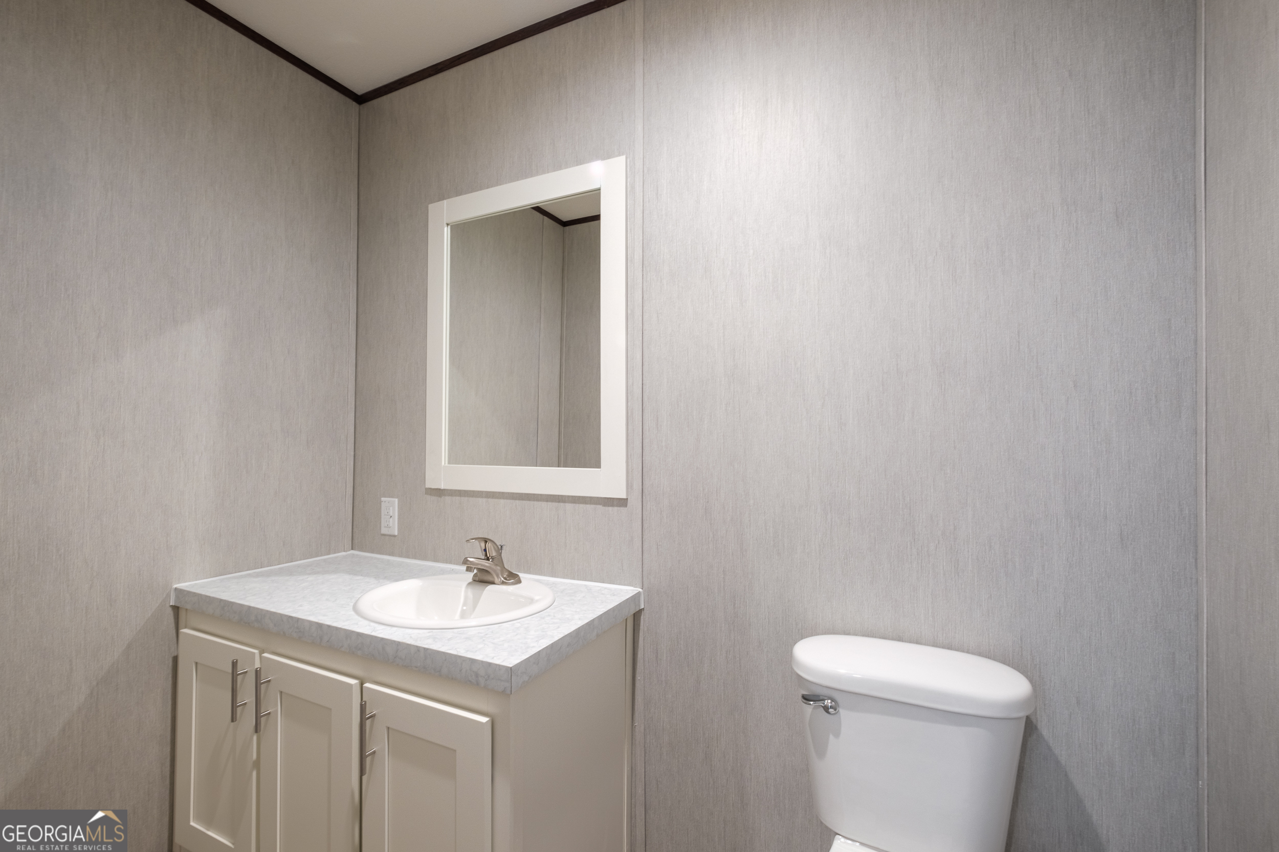 2959 Lake Lannell Road Odum, GA 31555 - Photo 20 of 30 a bathroom with a sink toilet and vanity