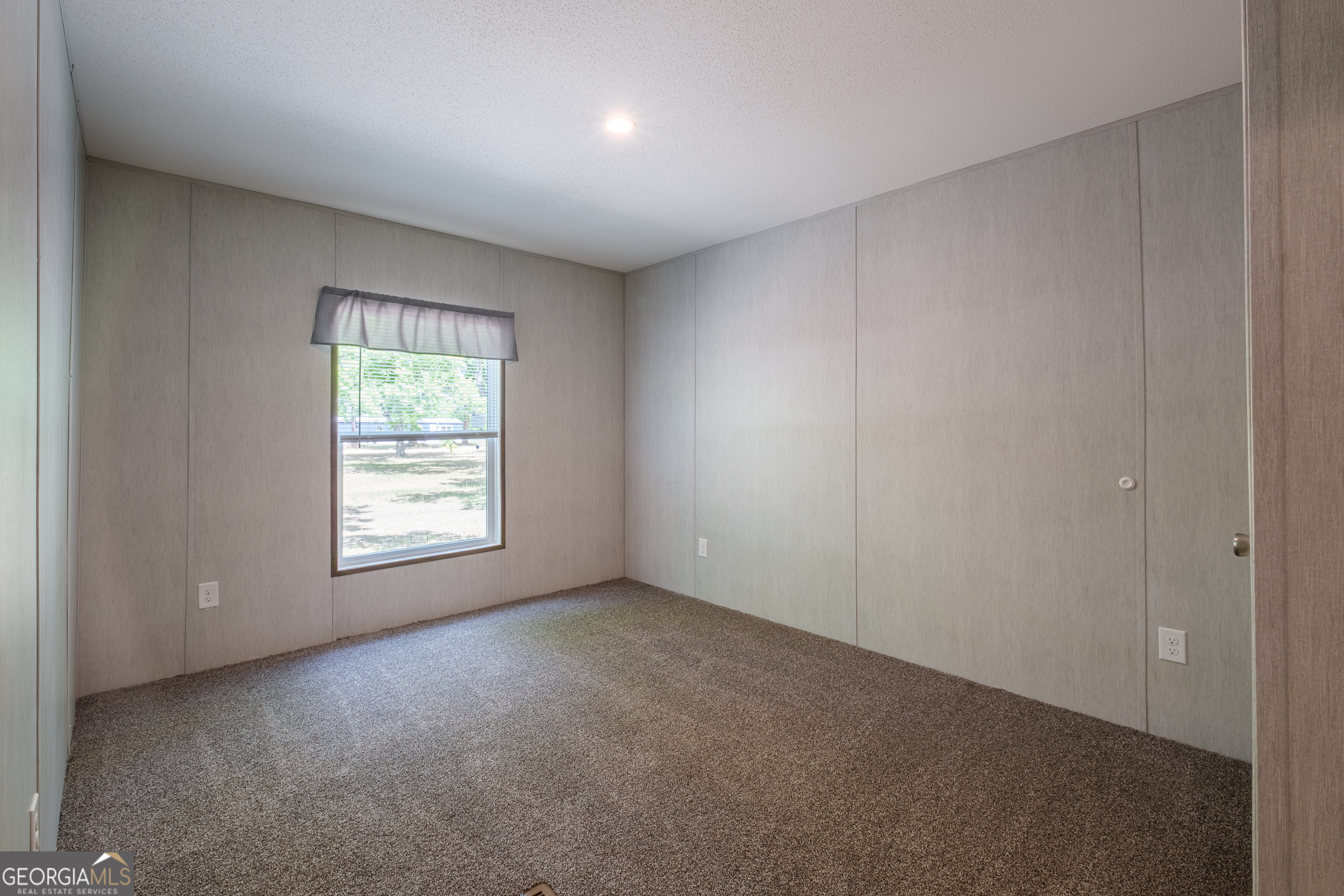 2959 Lake Lannell Road Odum, GA 31555 - Photo 21 of 30 an empty room with a window